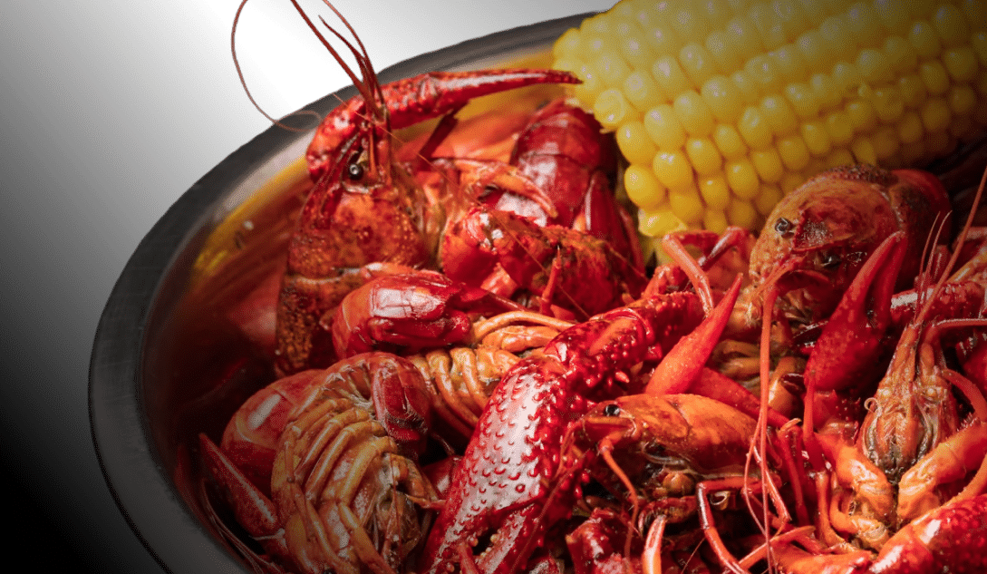 Bowl of boiled crawfish with corn